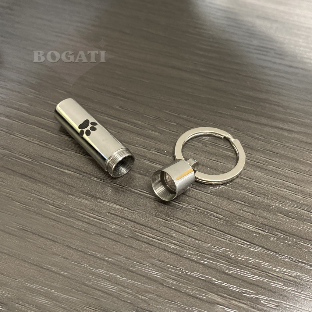 J-016 - Cylinder with Black Paw Print - Silver-tone - Keychain - Pack of 10