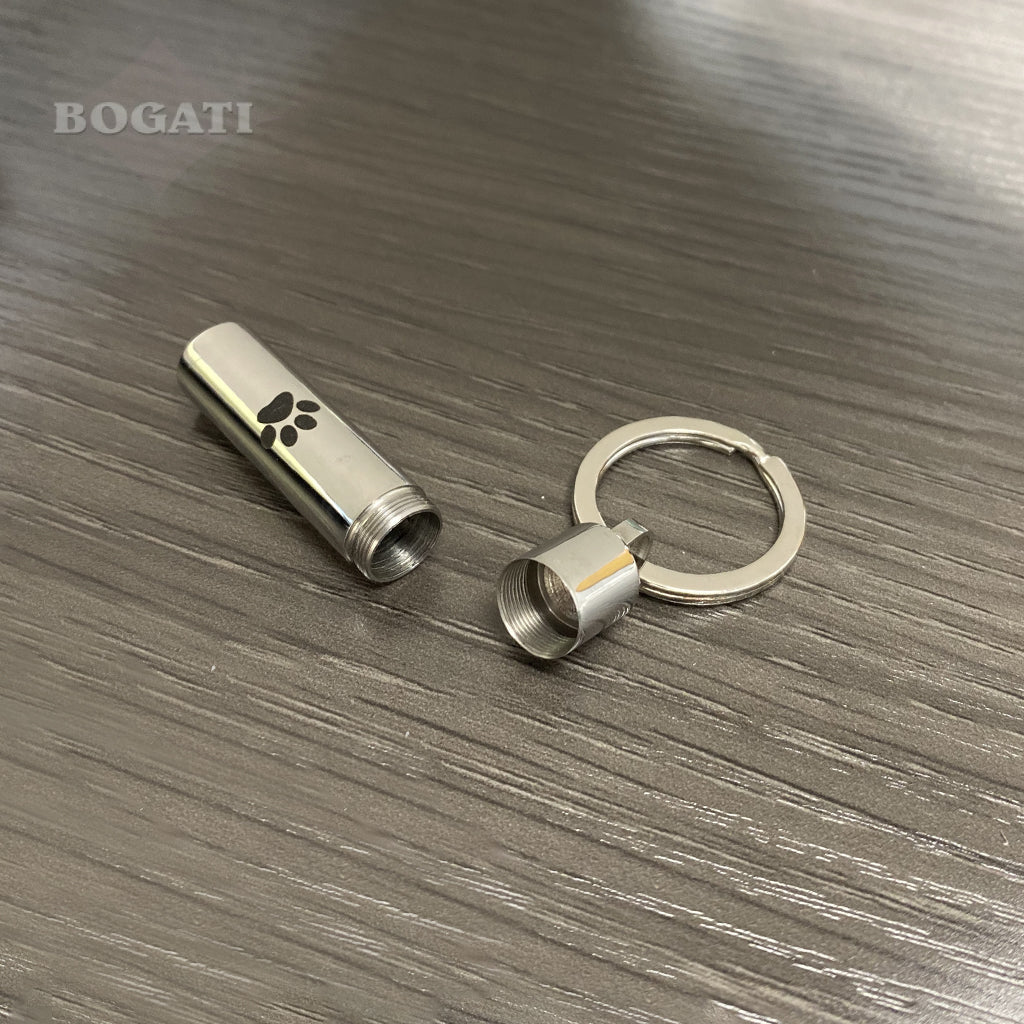 J-016 - Cylinder with Black Paw Print - Silver-tone - Keychain - Pack of 10